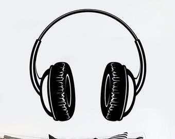 May include: Black and white silhouette of a pair of headphones on a white wall. The headphones are in the center of the image and are the main focus. The wall is plain and there is a white couch in the foreground.