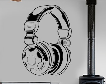 May include: Black and white illustration of a pair of headphones on a white wall. The headphones are large and have a detailed design. The illustration is in a living room setting with a fireplace and furniture.