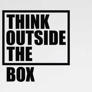 May include: Black and white wall decal with the text "Think Outside The Box" in a rectangular frame.