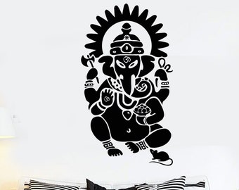 May include: Black and white silhouette wall decal of the Hindu deity Ganesha, with an elephant head, sitting with his legs crossed and holding a sweet in his hand. A rat is sitting at his feet.