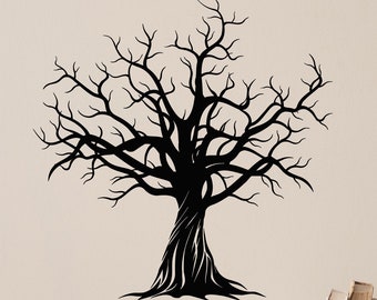May include: A black silhouette of a bare tree with branches reaching upwards against a white wall. The tree is centered in the image and is the main focal point.