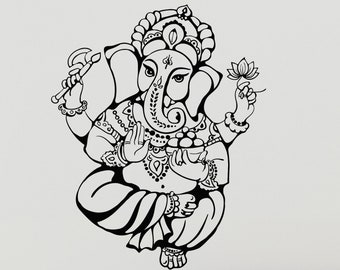 May include: Black and white wall decal of the Hindu deity Ganesha, an elephant-headed god, sitting in a meditative pose with four arms. The decal is on a white wall in a living room setting with a gray sofa and a side table with plants.