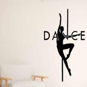 May include: Black and white silhouette of a dancer with the word "DANCE" incorporated into the design. The dancer is holding a pole and is in a pose with one leg extended.