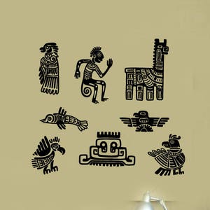 May include: Black and white wall decals featuring stylized images of birds, animals, and geometric shapes. The decals are on a beige wall above a desk with a blue chair.