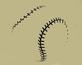 May include: Black baseball wall decal with stitching detail, shown on a beige wall above a desk with a lamp and office supplies.