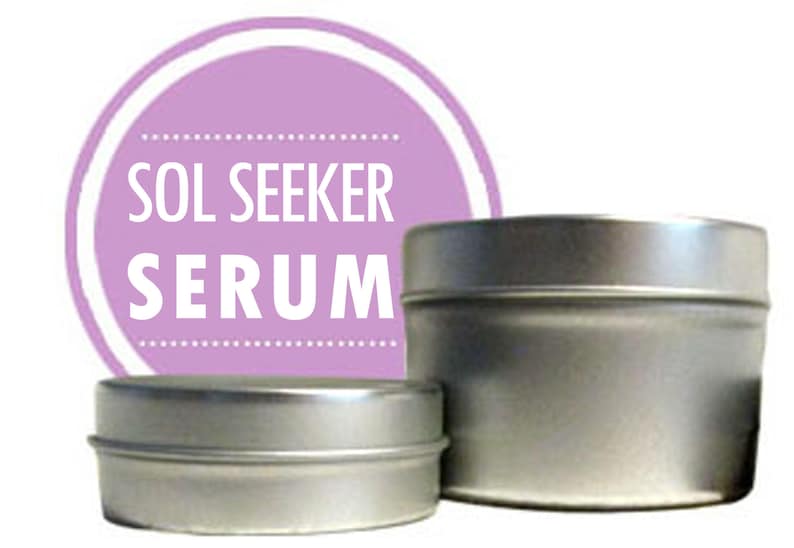 May include: Two silver metal containers with a purple label that reads "SOL SEEKER SERUM".