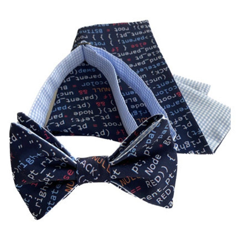 May include: A blue bow tie with a white and blue patterned pocket square. The bow tie and pocket square feature code printed on them.