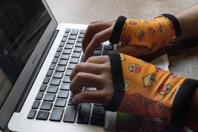 Instafluff fingerless gloves in use at a laptop