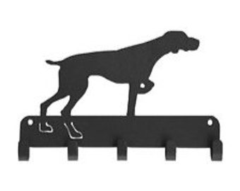 May include: Black metal key holder featuring a silhouette of a dog. The key holder has four hooks and is designed to be mounted on a wall. The dog silhouette is in a pointing pose.