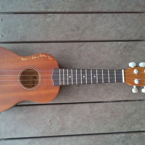 Woodburned and engraved ukelele