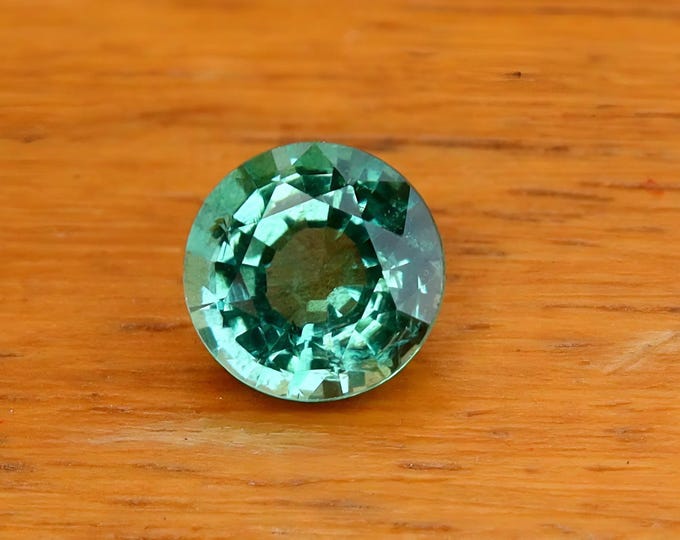 Natural Zambian Emerald: 0.62 Carat Round Cut Gemstone, GSI Certified