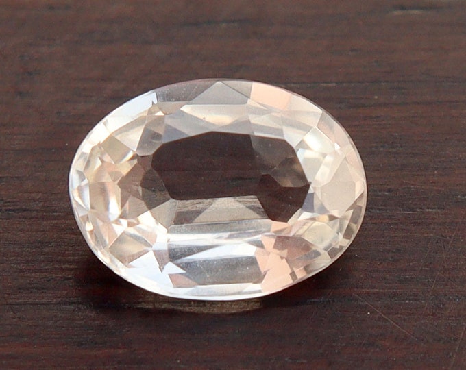 Certified Peach Sapphire: 1.36 Carat Oval Cut, Unheated Gemstone