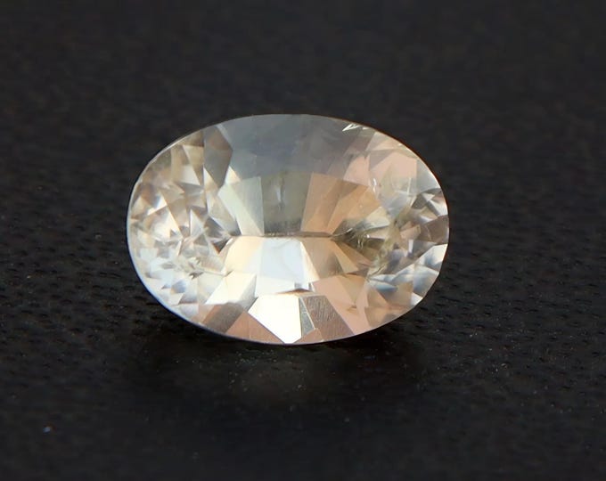 Certified Pastel Yellow Sapphire: 1.23 Carat Oval Cut Gemstone