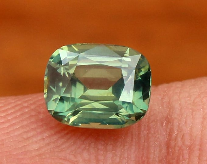 Parti Sapphire Gemstone: 1.56 Carat Yellowish Green Cushion Cut, Madagascar