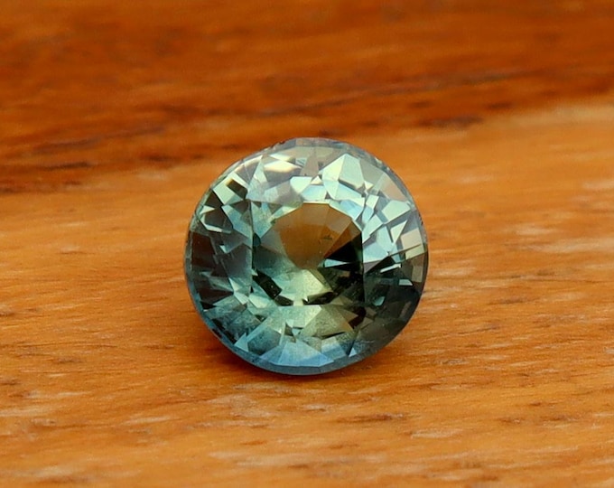 GSI Certified Parti Teal Sapphire: 1.02 Carat Roundish Oval Cut Loose Gemstone