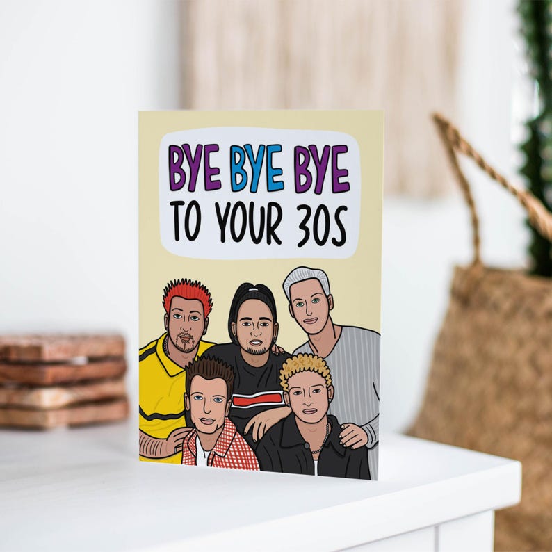 May include: A greeting card with a cartoon illustration of five people with the text "Bye Bye Bye to Your 30s" on a yellow background.
