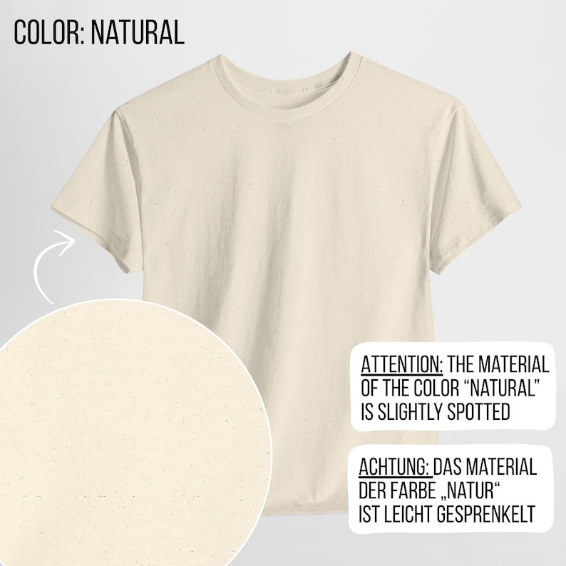May include: A short-sleeved t-shirt in a natural off-white color with a subtle speckled texture throughout the fabric. The image includes text stating COLOR: NATURAL and ATTENTION: THE MATERIAL OF THE COLOR "NATURAL" IS SLIGHTLY SPOTTED.