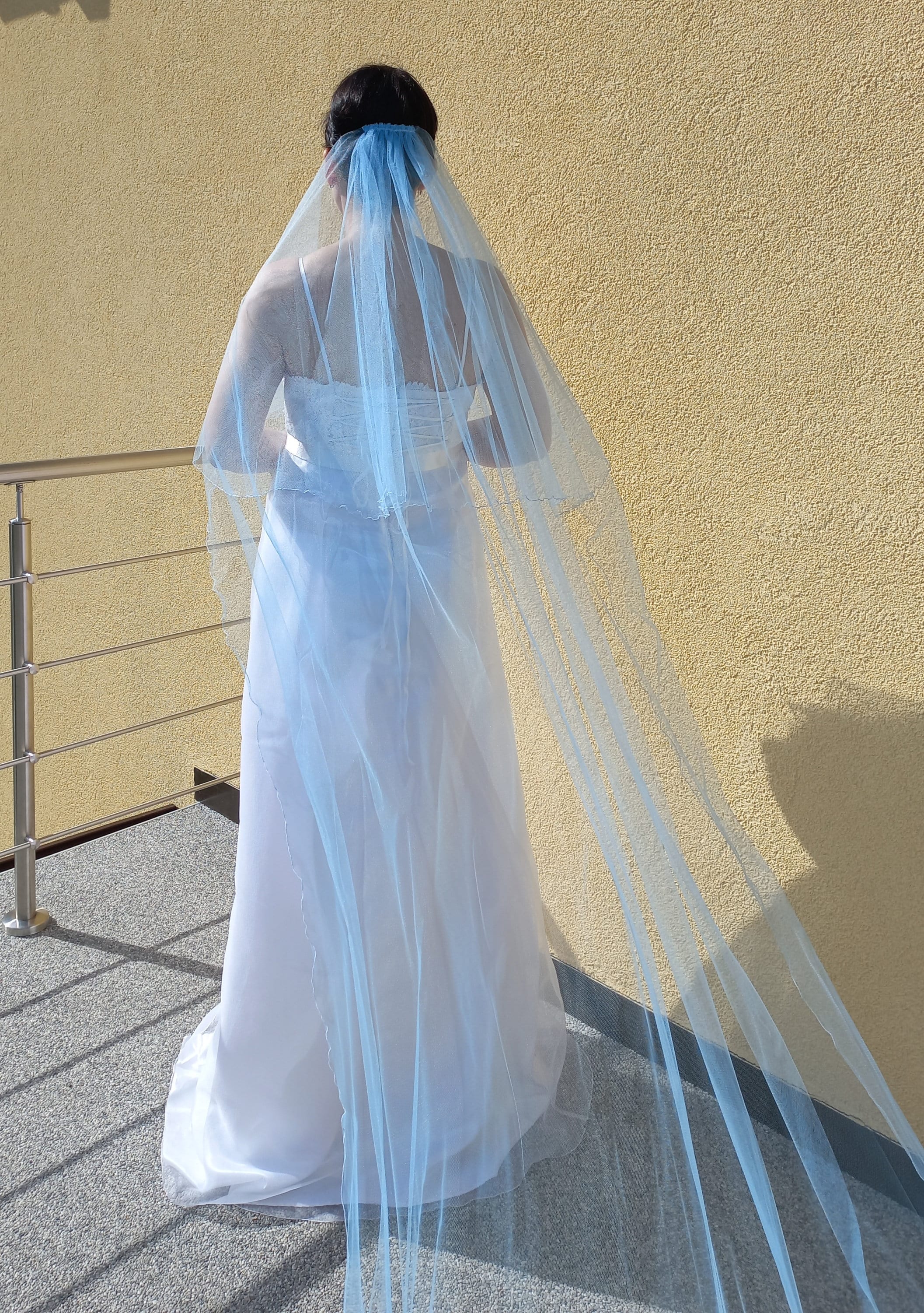 Light blue two tier cathedral veil with hand-sewn textile petals and  crystals