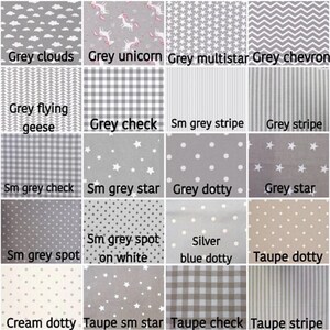 May include: A collection of 16 different fabric swatches in various shades of gray, taupe, and cream. The swatches feature a variety of patterns, including clouds, unicorns, stars, stripes, checks, dots, and chevron.
