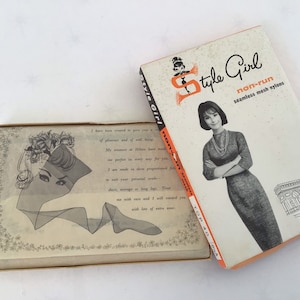 May include: Vintage "Style Girl" non-run seamless mesh nylons box. The box features a retro illustration of a woman and the text "Style Girl". An open box displays a printed illustration of a woman's face and a stocking.