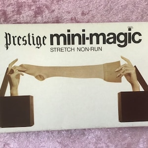 May include: A vintage box of "Prestige mini-magic" stretch non-run hosiery. The box features the product name in a stylized font, with an illustration of hands holding a stocking. The background is a light pink fabric.