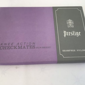 May include: A vintage box of "Checkmates" knee-action, run-resistant nylon stockings. The box is divided into two sections: a purple section with the text "Knee Action Checkmates Run-Resist" and a gray section with the word "Prestige" and "Seamfree Nylons".
