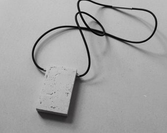 modern concrete necklace with golden ratio rectangle pendant made of concrete & stainless steel. Architectural necklace, concrete jewelry