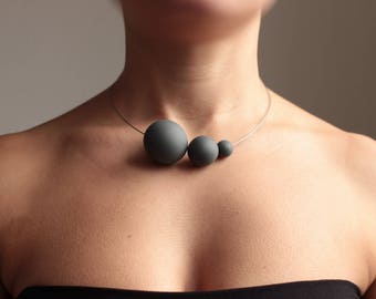 Minimal necklace PLUTONE from the modern jewelry collection SATELLITE. Black cobalt porcelain, simple unique choker, contemporary jewelry