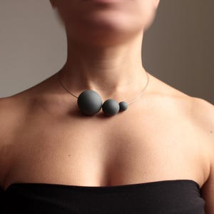 Statement necklace from the modern jewelry collection SATELLITE. Black porcelain handmade in Italy by ORTOGONALE