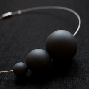 Minimal necklace PLUTONE from the modern jewelry collection image 2