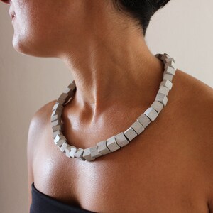 Geometric necklace with concrete cubic beads. Architecture to wear from the modern jewellery collection by ORTOGONALE image 3