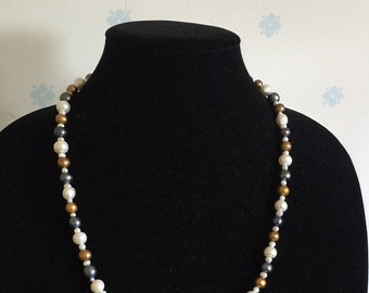 Fresh water pearls in black and white and gold.