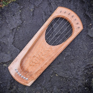 Lyre - Pentatonic 7 String - American Cherry - Open Back
