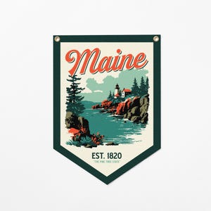 May include: A vintage-style banner featuring a coastal landscape with a lighthouse, trees, and ocean. The word "Maine" is in red script, with "EST. 1820" and "THE PINE TREE STATE" below. The banner has a dark green border and grommets.