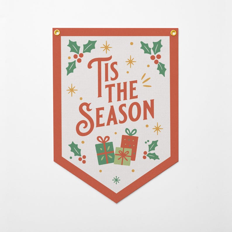 May include: A rectangular Christmas banner with a red border and gold grommets. The banner features the text "Tis the Season" in red, along with illustrations of holly, stars, and wrapped gifts in green and red.