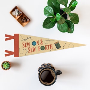 a sewing and sewing-related theme, with a pendant featuring the text "Sew & Sewforth" and a sewing kit, a small potted plant, a cup of coffee, and a small succulent plant.
