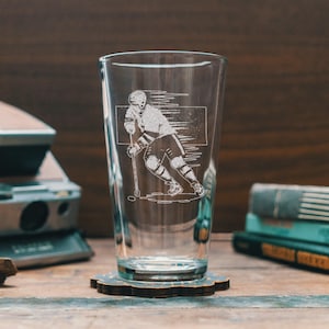 Custom Hockey Player Engraved Glasses | Personalized sport etched glassware for beer, whiskey, wine and cocktails. Home decor & league gift.