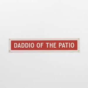 May include: A rustic wooden sign with the text "Welcome to our home" in white lettering. The sign features a distressed finish and a simple, inviting design, perfect for entryway decor.