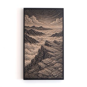 May include: Black and tan landscape art print depicting a mountain range above a sea of clouds. The artwork features a detailed illustration style with a rocky foreground and a cloudy sky.
