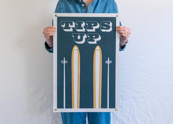 A handmade felt pennant banner channeling authentic vintage ski lodge vibes — the kind of wall piece that sparks a whole conversation about powder days.