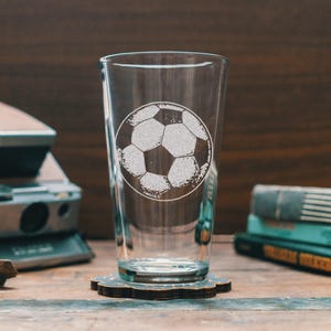 Custom Soccer Ball Engraved Glasses | Personalized Futbol sport glassware for beer, whiskey, wine and cocktails. Home decor & league gift.