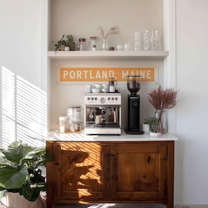 May include: A set of three ceramic mugs with a speckled, matte finish. The mugs are in shades of cream, light gray, and dark gray. Each mug has a simple, minimalist design, perfect for coffee or tea.