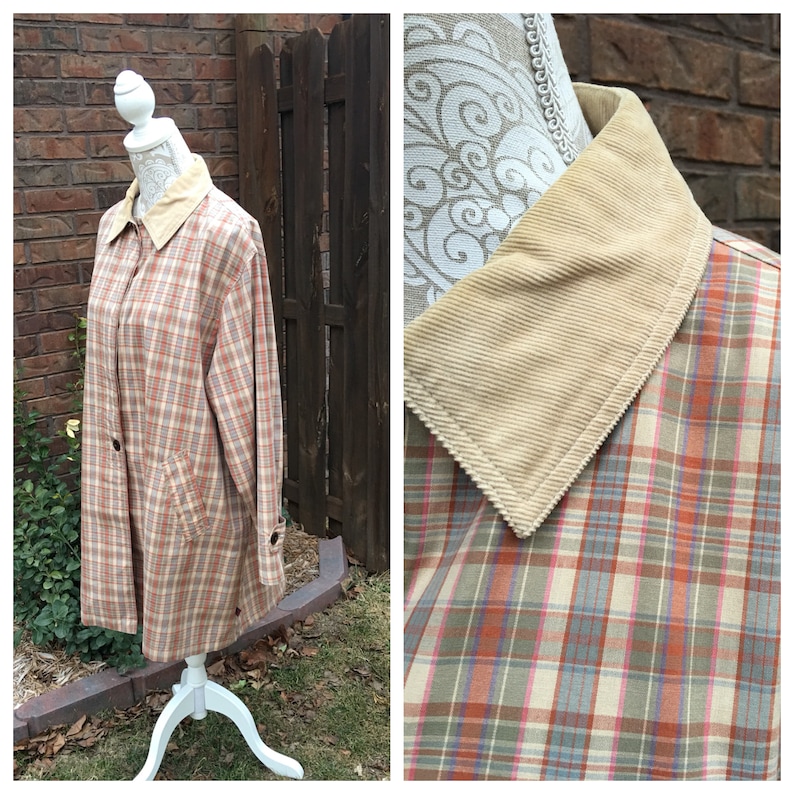 May include: A long-sleeved plaid jacket with a corduroy collar. The jacket is in shades of brown, pink, and blue.