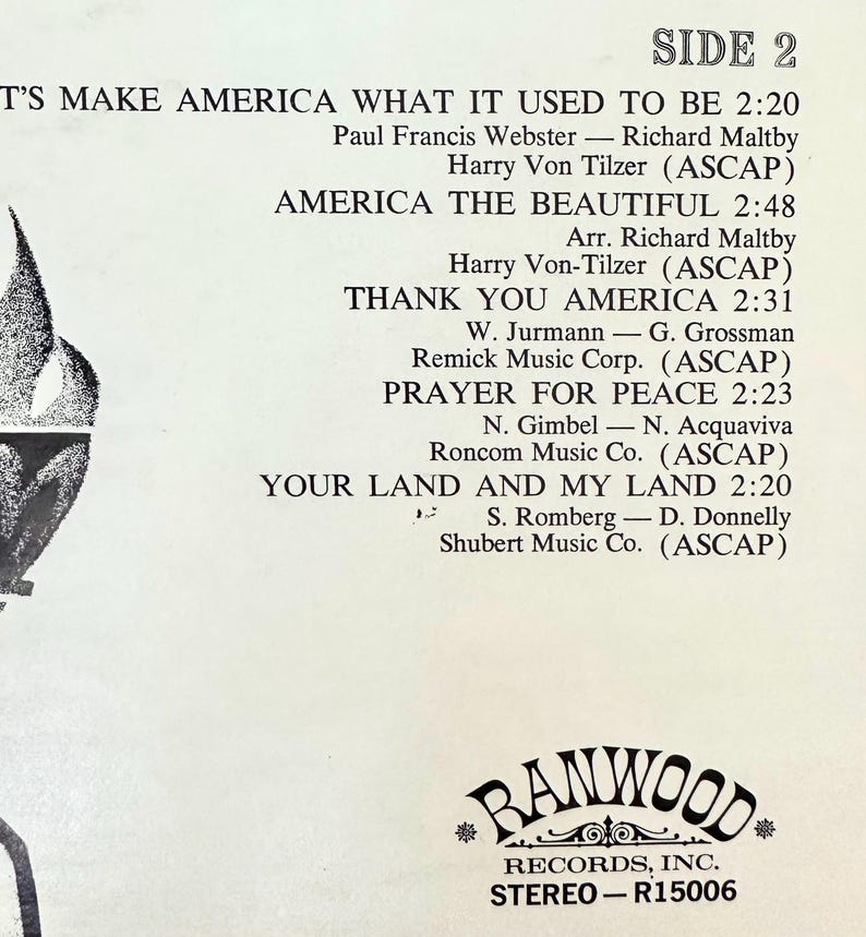 Op de afbeelding: Een witte vinyl platenhoes met zwarte tekst die de nummers van KANT 2 vermeldt: LET'S MAKE AMERICA WHAT IT USED TO BE, AMERICA THE BEAUTIFUL, THANK YOU AMERICA, PRAYER FOR PEACE en YOUR LAND AND MY LAND, met het Ranwood Records logo onderaan.