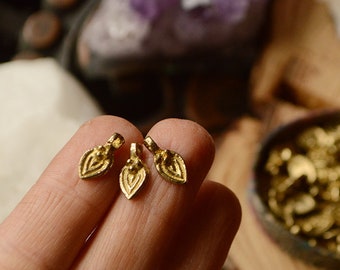 10 Tiny tear drop tribal solid brass charms.  14 mm. Lovely for macrame, wire, crafts, beading work. 10 pieces. 1.5 mm hole
