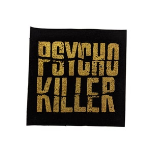 May include: Black fabric patch with gold lettering that reads "DEVIL PSYCHO KILLER".