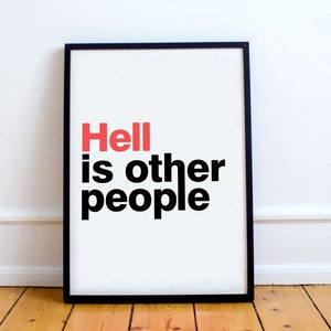 May include: A black framed print with the text "Hell is other people" in bold black letters. The word "Hell" is in red.