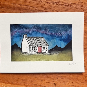 Bothy Lino print with watercolour starry sky/ northern lights.