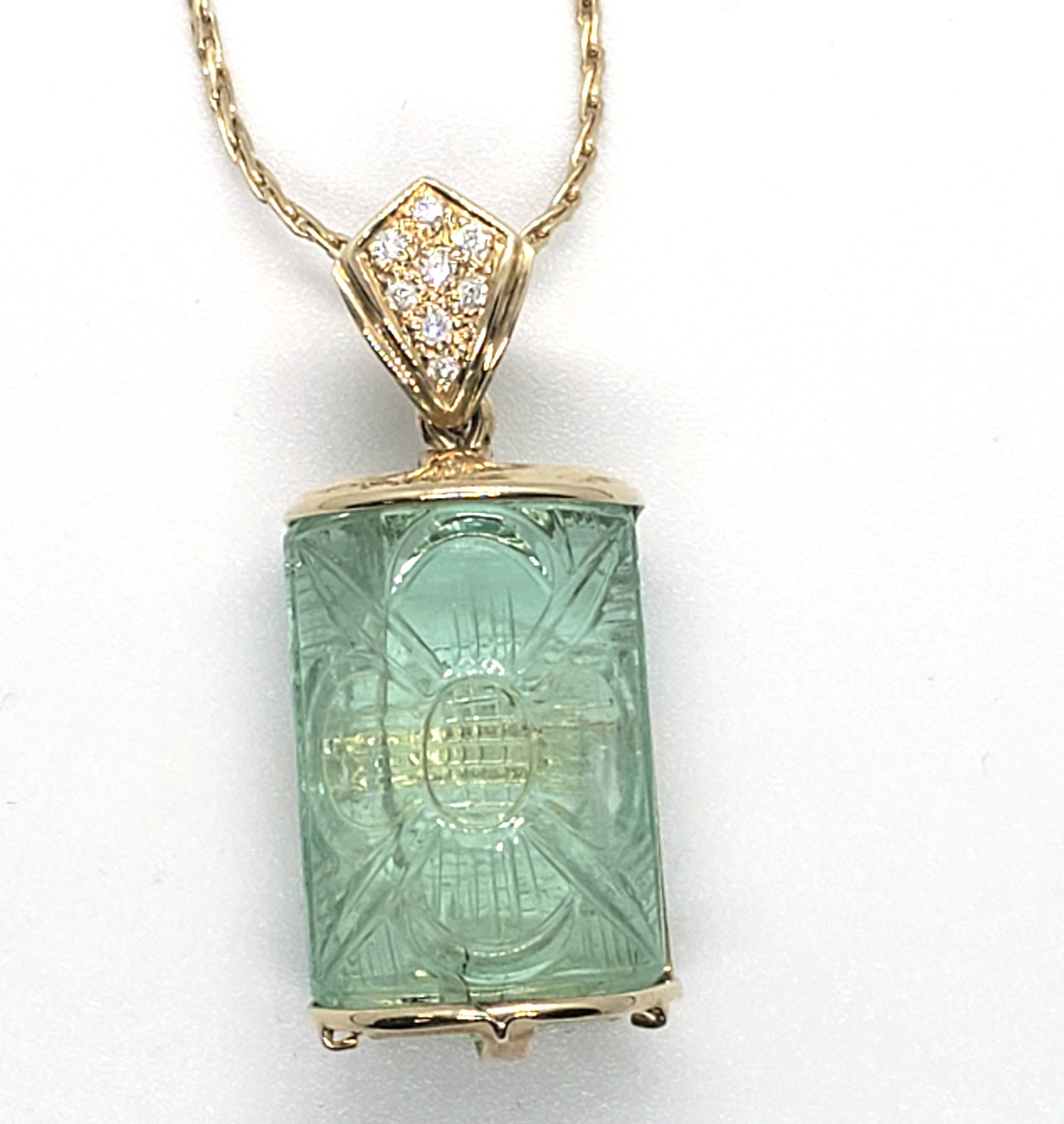 Carved emerald pendant discount