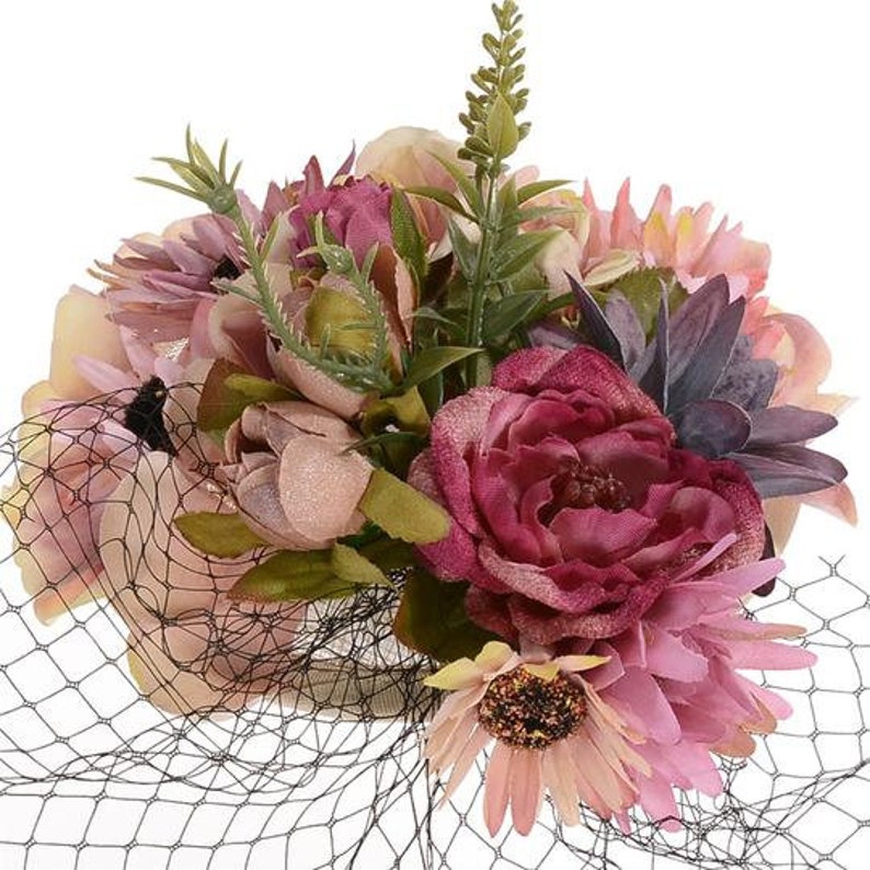 Wedding Guest Races Pink flower fascinator with black cage veil
